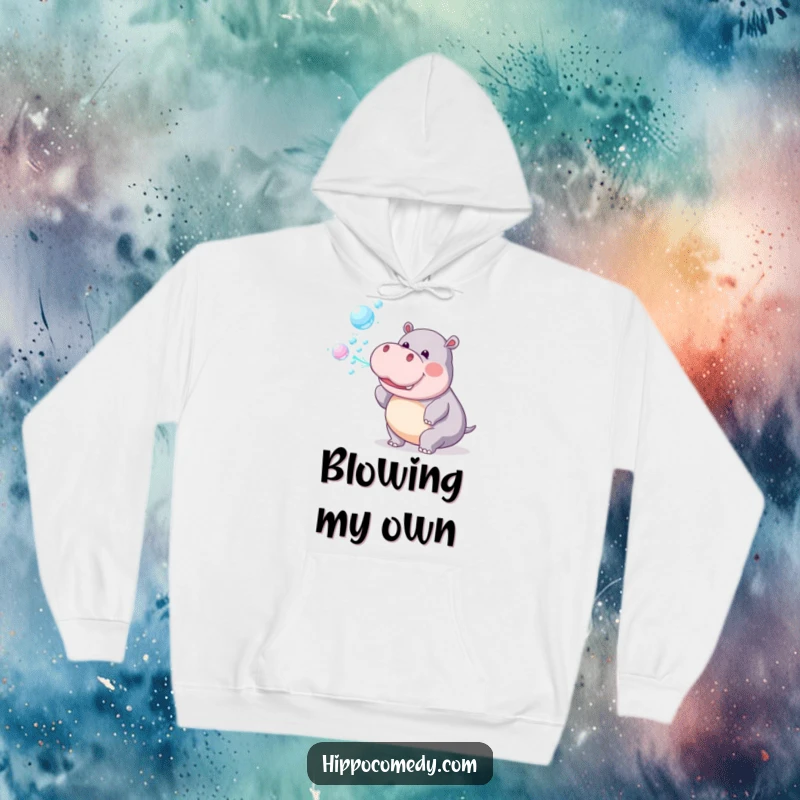 Funny Hoodie: A playful hippopotamus cheerfully blows a stream of iridescent rainbow bubbles, adding magic.