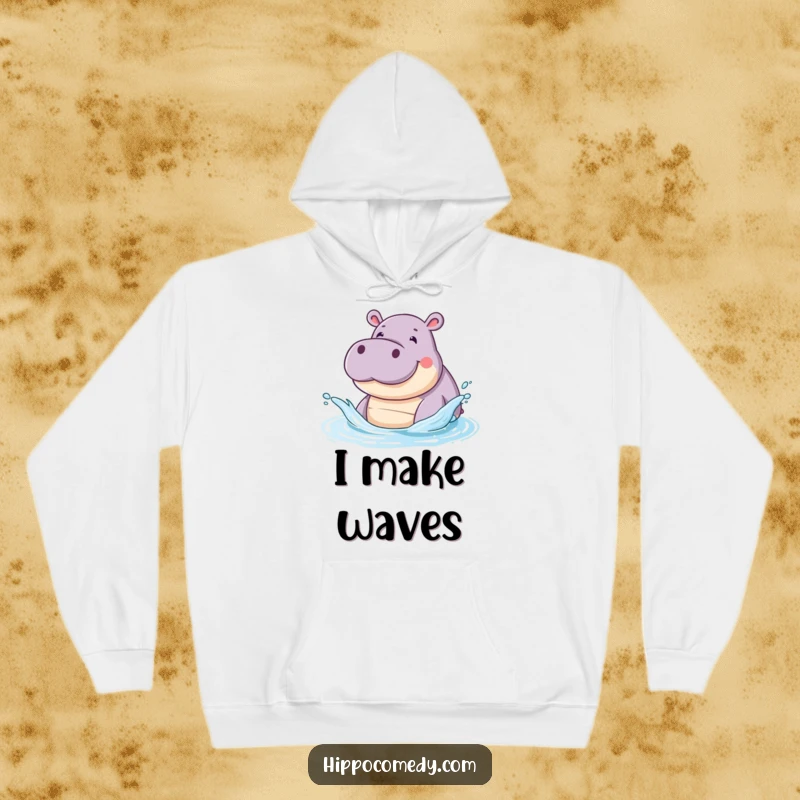 Funny hoodie with a smiling hippopotamus artistically splashing water with its snout, embodying playful and happy vibes.
