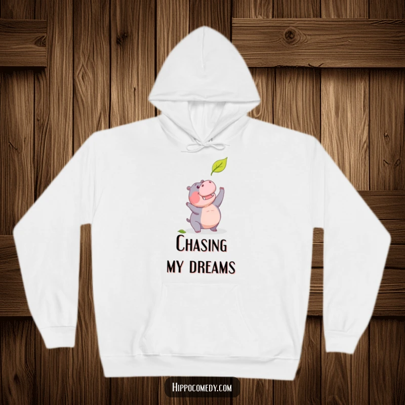 Funny hoodie with a determined hippopotamus making a humorous attempt to catch a falling leaf.