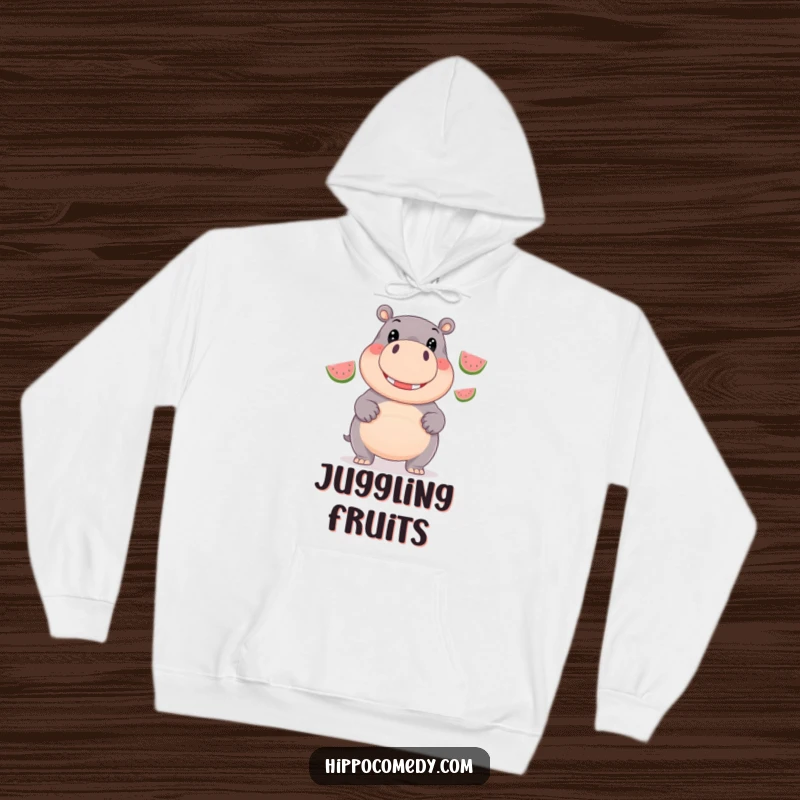 Funny Hoodie: A giggling hippopotamus with wide, happy eyes skillfully juggles three shiny watermelons.