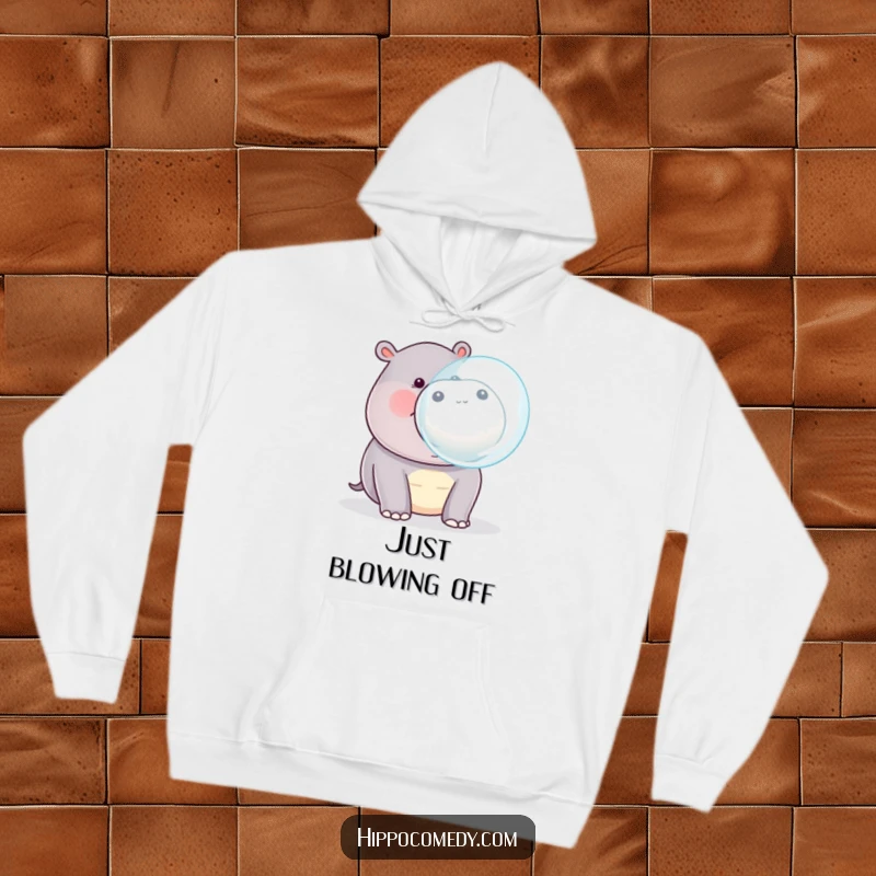 Funny kawaii hippopotamus blowing a large bubble from its mouth, printed on a soft, warm hoodie.