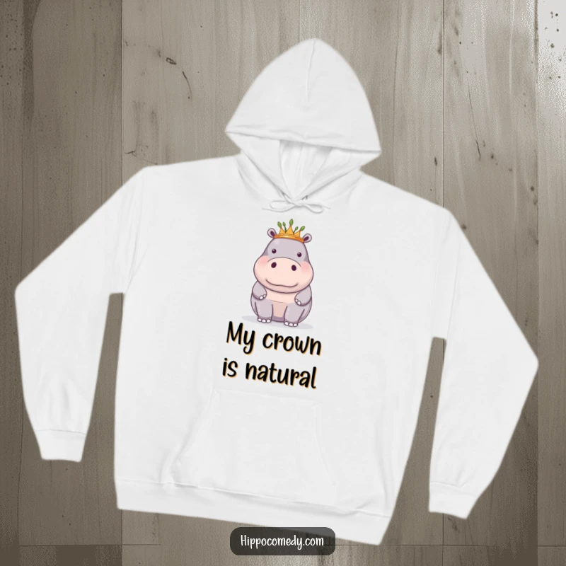 Funny hoodie with a proud hippopotamus adorned with a tiny crown of reeds, offering regal comfort.