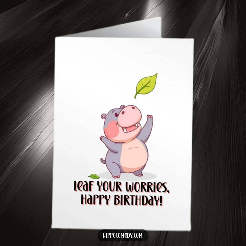 Funny Free Printable Birthday Card: A focused hippopotamus leaps with all its might, trying to snag a tiny falling leaf before it hits the ground.