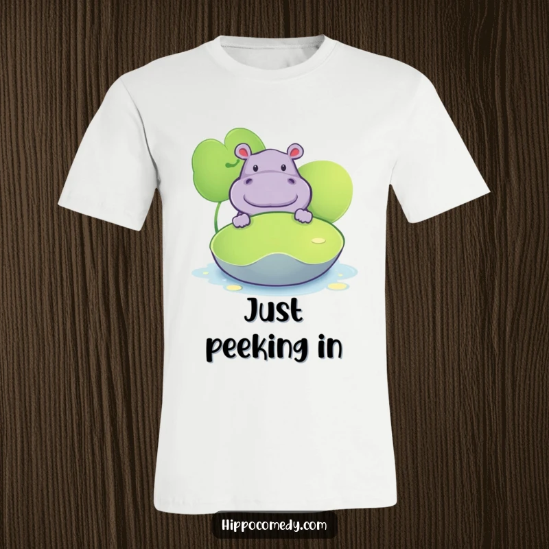 Funny t-shirt illustrating a hippopotamus curiously peeking from behind a large lily pad, with a mischievous glint in its eye.