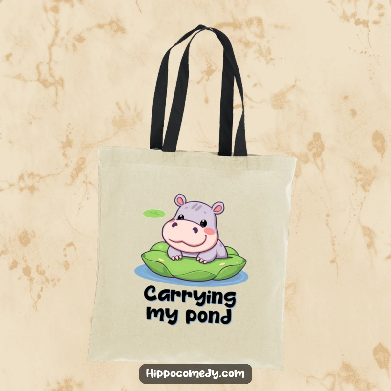 Funny tote bag art of a kawaii hippopotamus with a silly expression, peeking out from a vibrant lily pad.
